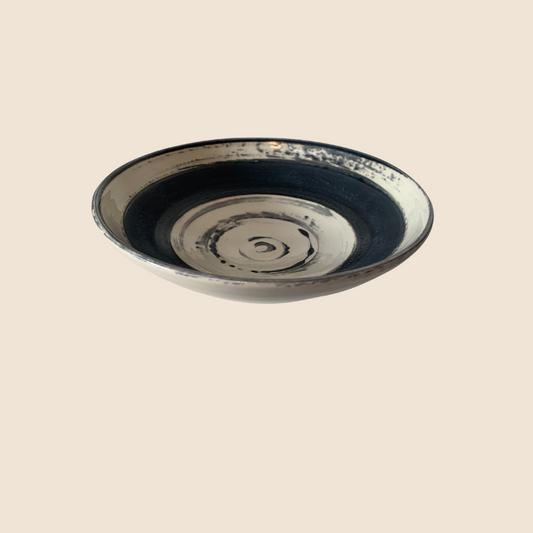 White bowl with rough texture black glaze